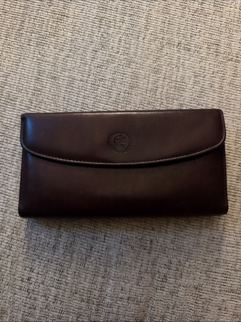 Elegant Brown Leather Clutch Wallet with Embossed Crest